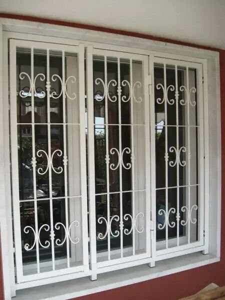 Classic White Wrought Iron Window Security Grill with Decorative Scrollwork