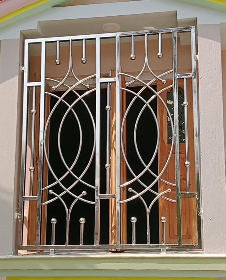 Modern Stainless Steel Window Grill with Elegant Curved Design