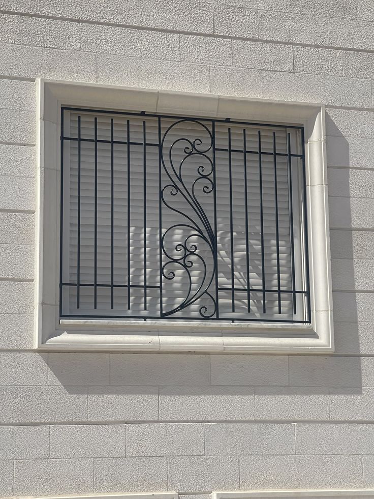 Decorative Wrought Iron Window Grill with Elegant Scroll Design